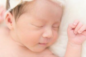 Sleeping newborn girl photographed by award winning Vancouver photographer Wendy J Photography.