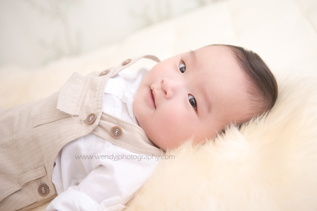 6 month old baby boy photographed by award winning child and baby photographer Wendy J.