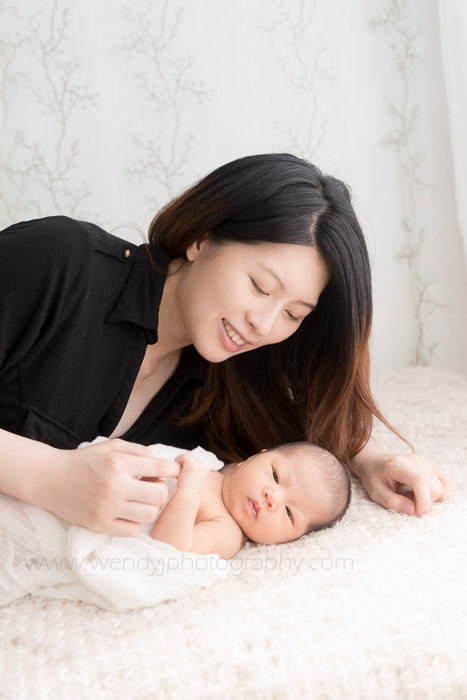 Newborn baby girl with her mother.