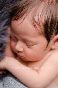 Close-up of a sleeping newborn baby girl.